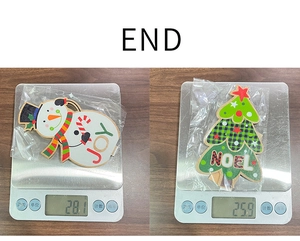 Detail showing weight of wooden snowman and Christmas tree ornaments on a digital scale