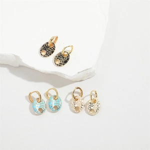 Minimalist oval earrings in black, blue and white on stone base with golden accents