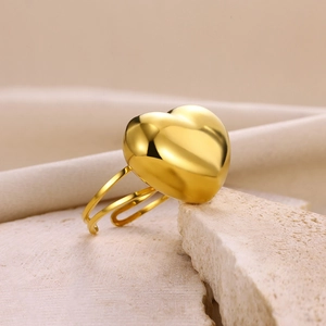 Detail view of heart-shaped gold stainless steel ring with double-layered open design