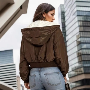 Rear view of brown hooded crop jacket showing thick fleece lining and urban outdoor style