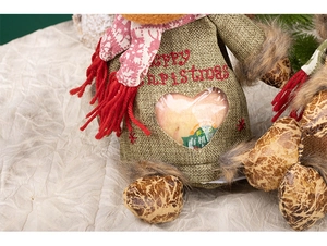 Detail of Christmas burlap gift bag with Merry Christmas embroidery and heart window