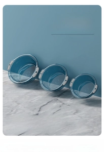 Detailed view of three blue transparent washbasins with non-slip handles in M L XL sizes