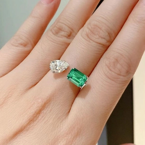 Elegant emerald cut green gemstone and pear shape diamond open ring in silver finish