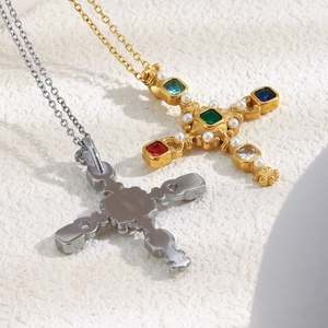 Detailed front and back view of baroque cross necklace with colorful gems and pearls