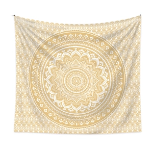 Detail of bohemian mandala tapestry featuring intricate golden orange and white floral patterns