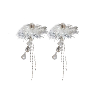 Silver bow tassel pearl earrings with sparkling rhinestones on a clean white background