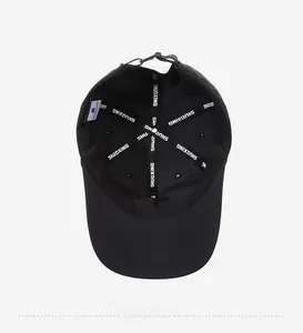 Detail view of the breathable mesh lining and reinforced seams on black baseball cap