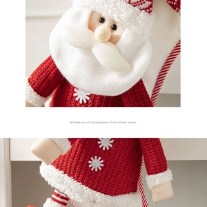 Detail of plush Santa gift bag with red knitted fabric and festive holiday embroidery