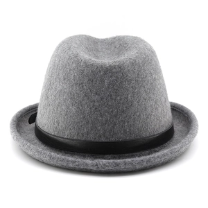 Close-up of a dark grey wool fedora hat featuring a black faux leather decorative band