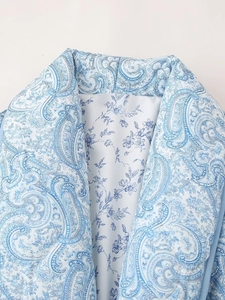Detail of quilted floral jacket collar with blue paisley print and soft lining