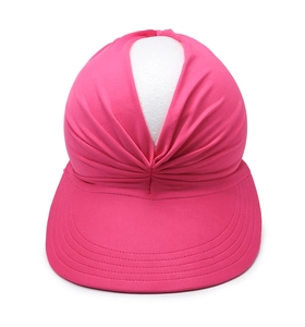 Close-up of rose red sun visor with pleated design and empty top for women outdoor sports