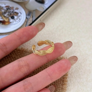 Minimalist 18K gold braided open ring with elegant multi-strand twisted metal wire design