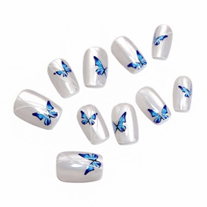 Blue butterfly cat eye press-on nails with pearlescent white finish and silver lines