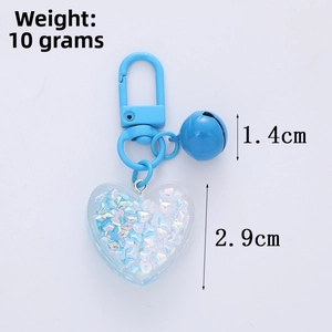 Detailed size view of blue heart keychain with bell and lobster clasp, 10g weight