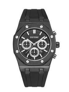 Close-up of black chronograph watch featuring octagonal bezel and rubber strap