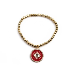 Bracelet en perles dorées avec un pendentif œil protecteur en émail rouge et strass blancs