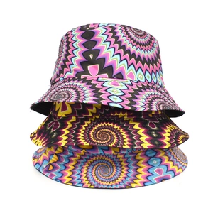 Three bucket hats featuring vibrant psychedelic spiral patterns and durable fabric textures