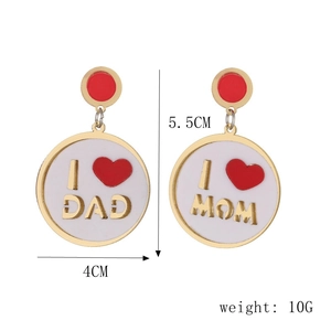 Close-up of I Love MOM and DAD white enamel gold earrings with red heart patterns