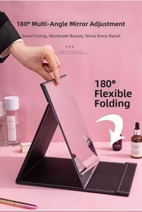 Detail showing the 180-degree folding mechanism of the portable black leather makeup mirror