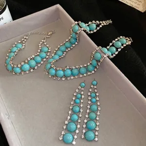 Parure de bijoux bohème avec pierres en résine turquoise et strass sur base en argent