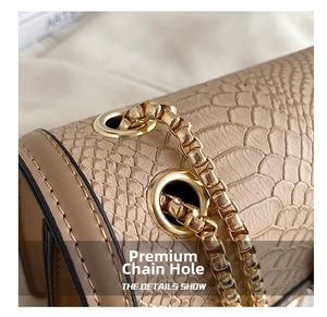 Detailed macro view of beige embossed leather texture and gold chain metal eyelets