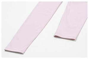 Detail of pink yoga leggings showing high-quality double-stitched hem and fabric texture