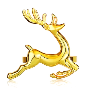 Polished golden reindeer napkin ring in a leaping pose for elegant table setting