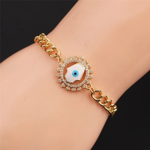 Detailed shot of Hamsa Hand bracelet with blue Evil Eye and pavé cubic zirconia