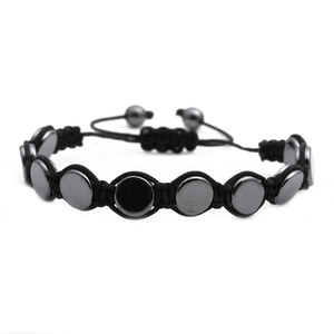 Adjustable black woven bracelet with polished hematite skull and bead ornaments