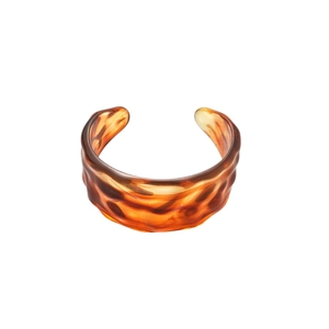 Retro tortoiseshell wide cuff bracelet with wavy texture and amber resin finish