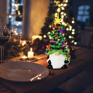Luminous ceramic Christmas gnome figurine with LED tree and colorful bulbs decoration