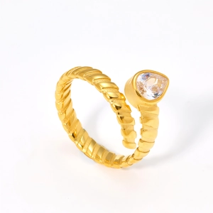 Detail of gold water drop ring featuring spiral twisted band and pear-cut zircon stone