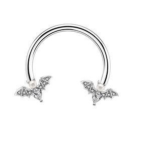 Detailed close-up of gothic horseshoe ring featuring sparkling bats with pearls and teardrop crystals