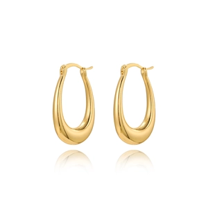 Polished golden teardrop hoop earrings with high mirror finish on a reflective white surface