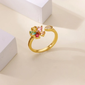 Macro shot of colorful zircon flower ring with gold plating on stone props