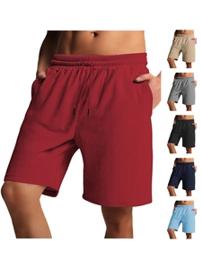 Detail shot of men's summer shorts showing elastic drawstring waist and woven texture fabric