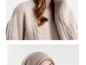 Detail of beige knit beanie featuring textured cable patterns and soft ribbed cashmere texture