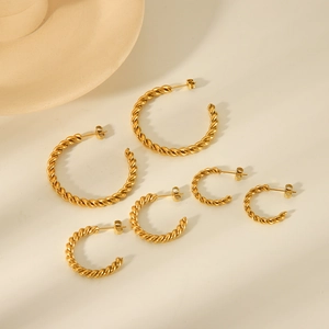 Three pairs of 18K gold plated twisted hoop earrings in large, medium, and small sizes