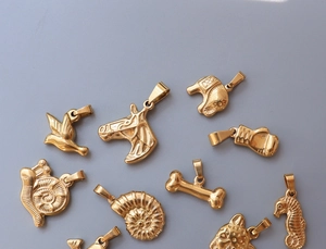 Detailed view of assorted 18K gold plated animal pendants for DIY jewelry making