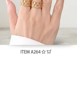 Close-up of hollow water drop textured gold rings worn on fingers with a white background