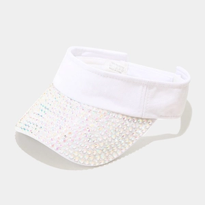 Detail of white polyester sun visor with shimmering iridescent rhinestones on the brim