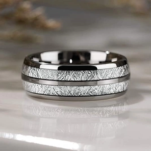 Macro detail of 8mm wide men's stainless steel ring with silver meteorite inlay textures