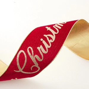 Red velvet Christmas ribbon with gold Merry Christmas lettering and golden satin back
