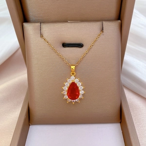 Luxurious gold titanium necklace with pear-cut ruby pendant in a premium gift box
