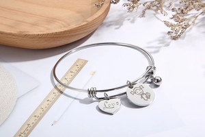 Adjustable stainless steel bracelet with Love heart charm, girl pendant and small bell