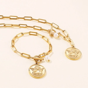 Golden paperclip chain necklace and bracelet set with angel relief coin and pearl charms