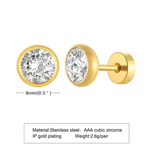 Macro detail of 8mm round cubic zirconia stud earrings with golden stainless steel frames