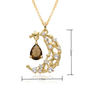 Macro view of crescent moon and star pendant with water drop gem, size 22mm by 17mm