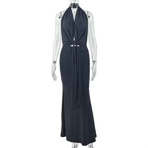 Detail of black halter neck long dress featuring waist knot design and slim fit cut