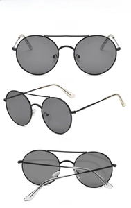 Front and side views of vintage round metal sunglasses with grey lenses and dual bridge
